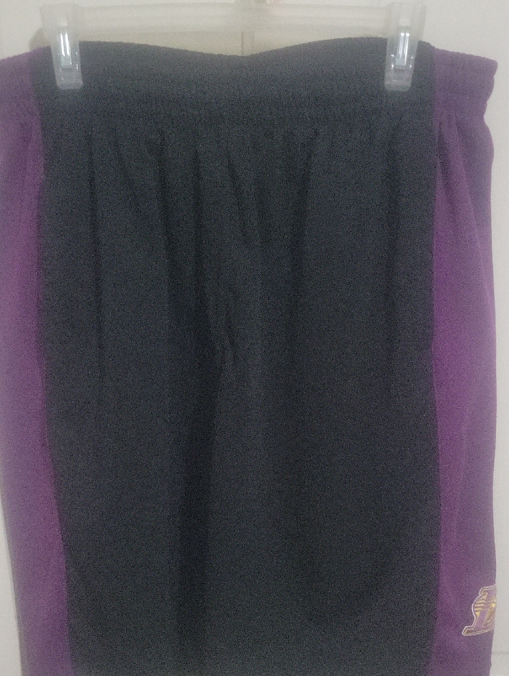 Black and Purple Athletic Shorts with Team Patch.